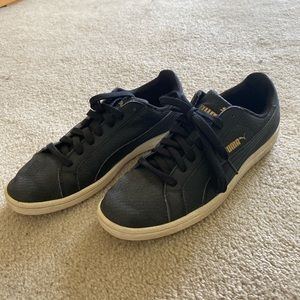 Matte black Puma sneakers